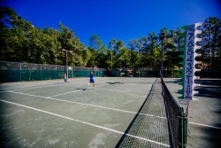 Students playing tennis on the MSP tennis courts